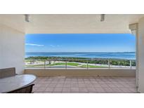 Breathtaking balcony view of the beautiful ocean and golf course beyond the railings at 3040 Grand Bay Blvd # 234, Longboat Key, FL 34228