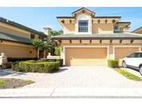 Inviting two-story home features a two-car garage and beautiful landscaping at 6512 Moorings Point Cir # 201, Lakewood Ranch, FL 34202