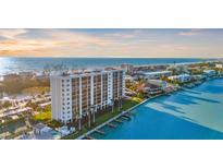 Beautiful waterfront condo building with private boat docks and views of the Gulf of Mexico at 9393 Midnight Pass Rd # 506, Sarasota, FL 34242