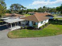 Charming home with a carport and well-maintained landscaping in a desirable neighborhood at 5020 Live Oak Cir, Bradenton, FL 34207