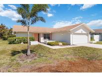 Charming single-story home featuring a well-maintained yard, lush landscaping, and a two-car garage, adding curb appeal at 6812 19Th W Ave, Bradenton, FL 34209