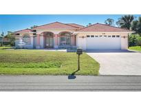 Charming single-Gathering home with a red tile roof, manicured lawn, and two car garage, perfect for a Gathering at 108 Mccabe St, Port Charlotte, FL 33953