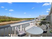 Relax on this inviting patio with comfortable seating and scenic water views at 1218 Spoonbill Landings Cir, Bradenton, FL 34209