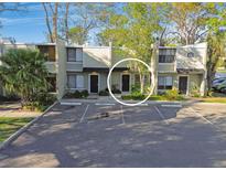 Inviting two-story condo with assigned parking and landscaping offering a blend of comfort and convenience at 4906 25Th W St # 106, Bradenton, FL 34207