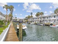 Beautiful waterfront homes with boat docks and lush tropical landscaping along a canal at 902 Gibbs Rd # 282, Venice, FL 34285