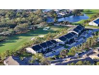 Beautiful aerial view of condo community with golf course and lush landscaping, offering a serene setting at 9570 High Gate Dr # 1722, Sarasota, FL 34238