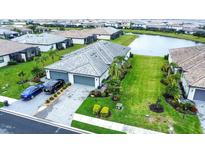 Beautiful home with manicured lawn, three car garage, and stunning landscaping in a desirable community at 16111 Sunny Day Dr, Bradenton, FL 34211