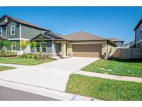 Charming single-Gathering home featuring a well-manicured lawn and two car garage at 22111 Nebula Way, Land O Lakes, FL 34637
