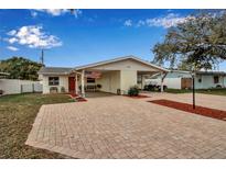 Charming single-story home with a covered carport and a brick-paved driveway at 5808 18Th W St # A & B, Bradenton, FL 34207