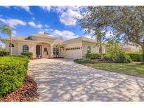 Lovely single story home with a large driveway and manicured landscaping at 6357 Royal Tern Cir, Lakewood Ranch, FL 34202