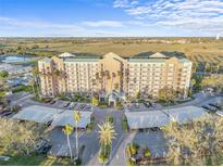 Stunning aerial view of a large condo complex, featuring lush landscaping and convenient covered parking at 2320 Terra Ceia Bay Blvd # 206, Palmetto, FL 34221