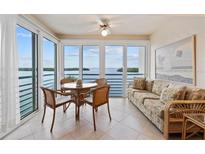 Bright dining area with large windows offering a stunning waterfront view, perfect for enjoying meals with a view at 4310 Falmouth Dr # 304, Longboat Key, FL 34228