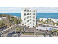 A multi-story building featuring convenient covered parking and stunning beach access at 4822 Ocean Blvd # 11E, Sarasota, FL 34242