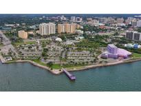Beautiful aerial view of waterfront property in urban environment with nearby park and waterside recreational opportunities at 750 N Tamiami Trl # 604, Sarasota, FL 34236