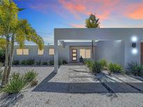 Modern home with a geometric walkway, white gravel landscaping, and a unique entryway design at 2308 Tulip St, Sarasota, FL 34239