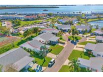 Charming single-story home in a serene, waterfront community featuring lush landscaping and ample parking at 9414 Andover Cir, Bradenton, FL 34210