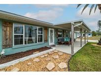 Welcoming front porch with comfortable seating, adding to the home's curb appeal at 4524 106Th W St, Bradenton, FL 34210