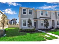 Charming two-story home with a well-maintained lawn and landscaped garden at 6265 Fairmont Ln, Palmetto, FL 34221