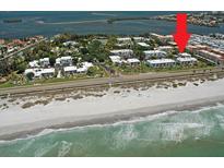 Stunning aerial view of beachfront condos with pristine beach and ocean access at 740 Bayport Way # 740, Longboat Key, FL 34228