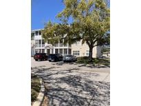 Three-story condo building with screened porches and parking for residents in a well-maintained community at 4802 51St W St # 1420, Bradenton, FL 34210