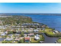 Beautiful aerial view of waterfront homes, canals, and lush greenery in a coastal community at 515 Leffingwell Ave # 210, Ellenton, FL 34222