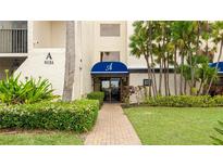 Welcoming entrance featuring well-maintained landscaping and a covered entryway at 6124 43Rd W St # 404A, Bradenton, FL 34210