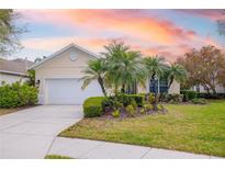 Charming single-story home with well-manicured lawn and professional tropical landscaping at 7351 Meeting St, Bradenton, FL 34201