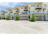 Charming three-story townhome with private balconies and convenient garage parking at 1429 Gulf N Dr, Bradenton Beach, FL 34217