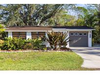 Charming home with lush landscaping and a well-maintained front yard at 603 Frances St, Nokomis, FL 34275