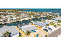 Waterfront home featuring a screened pool, private dock and boat lift, with gulf access at 3808 Royal Palm Dr, Bradenton, FL 34210