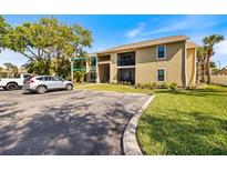 Inviting condo with well-maintained landscaping, parking, and a cozy facade with a patio entrance at 4009 Crockers Lake Blvd # 25, Sarasota, FL 34238