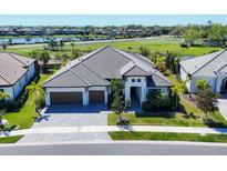 A luxurious two-story home featuring a beautifully paved driveway and a spacious three-car garage at 4629 Antrim Dr, Sarasota, FL 34240