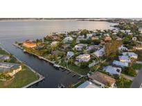 Beautiful waterfront home with mature landscaping, private boat dock and easy access to the bay at 504 59Th St, Holmes Beach, FL 34217