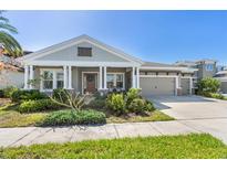 Charming single-story home with a well-manicured lawn and a three-car garage at 6913 Neopolitan Ct, Apollo Beach, FL 33572