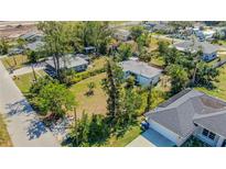 Charming residential property showcasing its expansive yard and classic exterior at 2830 Gypsy St, Sarasota, FL 34231
