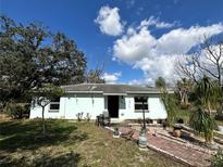 Charming single-story home featuring brick walkway, mature trees, and a well-maintained front yard at 6510 E 26Th Ave, Tampa, FL 33619