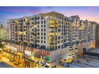 Modern condominium building featuring sleek architecture, ample windows, and private balconies in a vibrant city setting at 111 S Pineapple Ave # 804, Sarasota, FL 34236