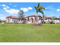 Beautiful single-story home with a well-manicured lawn and tasteful landscaping at 3551 Ridgeland Ct, Punta Gorda, FL 33982