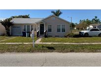 Charming single-Gathering home with a well-maintained front yard and quaint architectural details at 1104 29Th W Ave, Bradenton, FL 34205