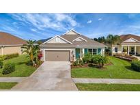Charming single-story home featuring a well-manicured lawn and inviting curb appeal at 16966 Rosedown Gln, Parrish, FL 34219