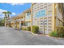 Park Lane Condominium exterior shows the building's entrance, signage, and well-maintained landscaping at 2155 Wood St # A20, Sarasota, FL 34237