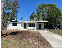 Well-maintained single-story home with a lush green lawn and a charming, welcoming entrance at 2404 Lehigh Ave, Bradenton, FL 34207