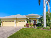 Charming single-story home with a three-car garage, beautiful landscaping and well-manicured lawn at 5087 Timber Chase Way, Sarasota, FL 34238