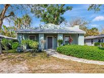 Charming single-story home with well-maintained landscaping and a welcoming walkway to the front door at 2021 Central Ave, Sarasota, FL 34234