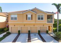 Charming multi-Gathering home featuring multiple garages and a tile roof, exuding curb appeal and functionality at 3456 Parkridge Cir # 33-105, Sarasota, FL 34243