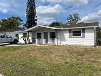 Charming single-story home with a well-maintained lawn and decorative accents at 3525 Emory Dr, Holiday, FL 34691