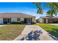 Inviting single-story home with a well-maintained lawn and covered front patio at 3605 60Th W St, Bradenton, FL 34209