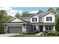 Charming two-story home with gray and white accents, two-car garage and landscaped yard at 9128 Radiant Cir, Sarasota, FL 34241