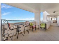 Inviting waterfront balcony with comfy seating, offering serene water views perfect for relaxing at 1270 Gulf Blvd # 1503, Clearwater Beach, FL 33767