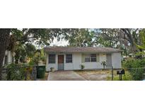 Modest single-story home featuring a cozy front yard, and natural surrounding landscaping at 1778 23Rd St, Sarasota, FL 34234